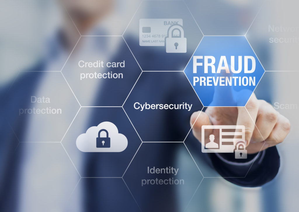 Person pointing at a graphic of the words Fraud Prevention