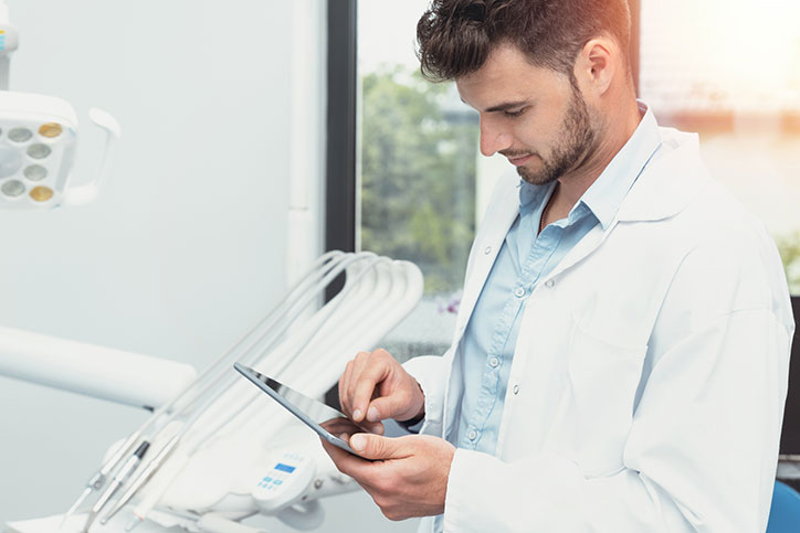 Dental staff using a tablet